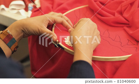 Woman hands and craft work. Embroider sewing by hand. Handicraft work by thread needle sew knit. Wood frame embroidery hoop. Needlework handicraft crafting quarantine leisure concept. Woman hands and craft work. Embroider sewing by hand. Handicraft work by thread needle sew knit. Wood frame embroidery hoop. Needlework handicraft crafting quarantine leisure concept. 81040600