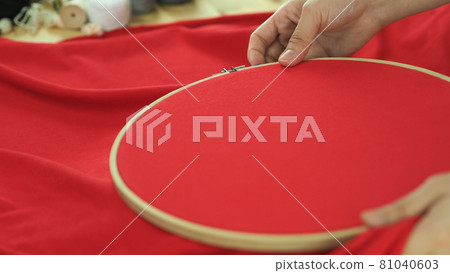 Woman hands and craft work. Embroider sewing by hand. Handicraft work by thread needle sew knit. Wood frame embroidery hoop. Needlework handicraft crafting quarantine leisure concept. Woman hands and craft work. Embroider sewing by hand. Handicraft work by thread needle sew knit. Wood frame embroidery hoop. Needlework handicraft crafting quarantine leisure concept. 81040603