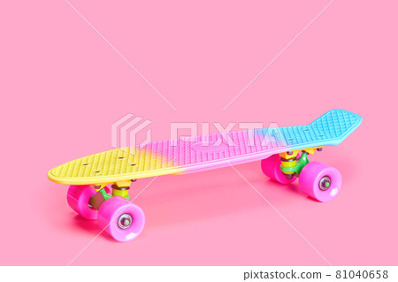 rainbow plastic Penny board skateboard isolated on pink background 81040658