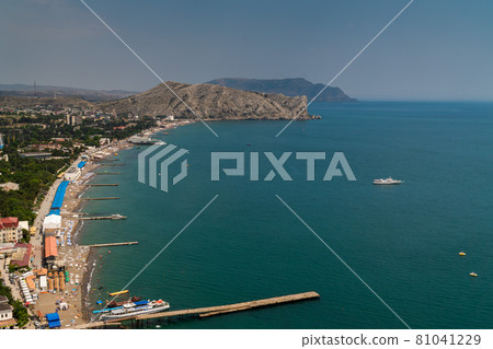 The Republic of Crimea. July 12, 2021. Summer picturesque view of the city of Sudak from the height of the Genoese fortress, located on the Serf mountain. 81041229