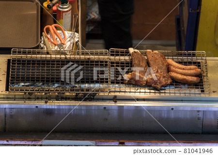 Meat on the grill. Fresh food offer at Vietnam's Marketplace at Saigon city. Meat on the grill. Fresh food offer at Vietnam's Marketplace at Saigon city. 81041946