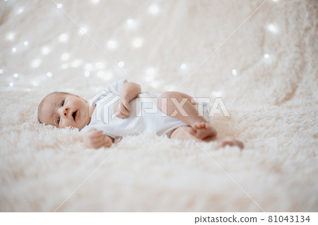 wonderful newborn baby lying on a soft blanket. wonderful newborn baby lying on a soft blanket. 81043134