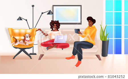 african american couple relaxing at home social media network online communication relaxation concept 81043252