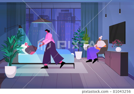 friendly nurse or volunteer supporting elderly man patient lying in bed home care services healthcare concept 81043256