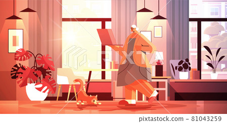 senior woman using laptop grandmother relaxing at home social media network online communication concept 81043259