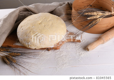 Raw homemande dough for bread or pizza with ears of wheat 81045565