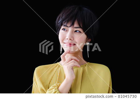 Young woman with short hair black back 81045730