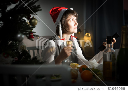 Upset girl at the holiday table on Christmas night Upset girl at the holiday table on Christmas night 81046066