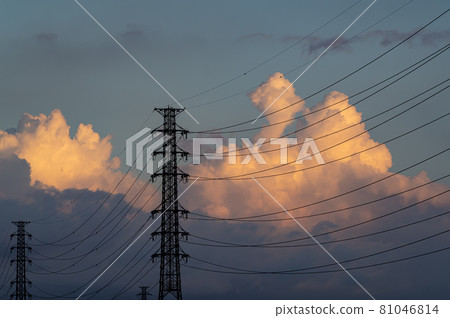Cumulonimbus clouds rising in the power transmission tower and the blue sky in the evening a-1 81046814