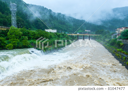 River that was flooded by heavy rain 81047477
