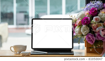 Mock up digital tablet with blank white screen on workplace at office. Online Education Concept 81050047