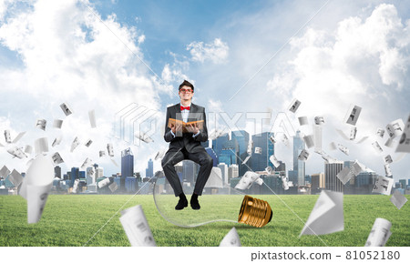 young businessman with a book 81052180