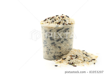 Three kinds of rice in a plastic rice measuring cup, small heap rice is besides, the image on white background, front view, close up image of mixed rice, white, brown, black. Three kinds of rice in a plastic rice measuring cup, small heap rice is besides, the image on white background, front view, close up image of mixed rice, white, brown, black. 81053207