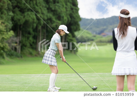 Female tee shot driver enjoying golf 81053959