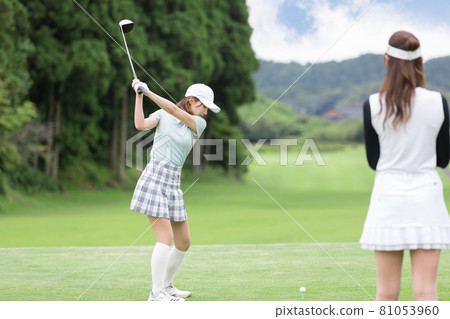 Female tee shot driver enjoying golf Female tee shot driver enjoying golf 81053960