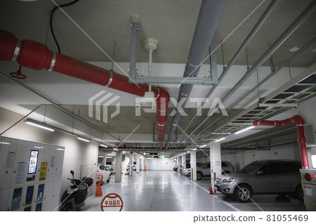 Piping in an apartment's underground parking lot 81055469