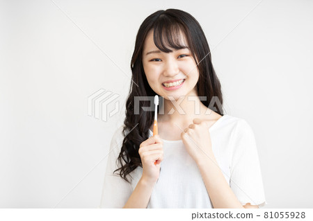 Teenage woman doing dental care Teenage woman doing dental care 81055928