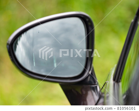 Drivers wing mirror with inclear view into cabin. Modern car Drivers wing mirror with inclear view into cabin. Modern car 81056101