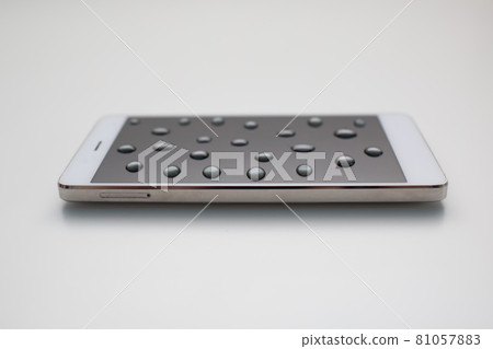 Mobile phone with drops on oleophobic screen. 81057883