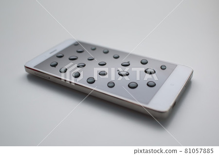 Mobile phone with drops on oleophobic screen. 81057885