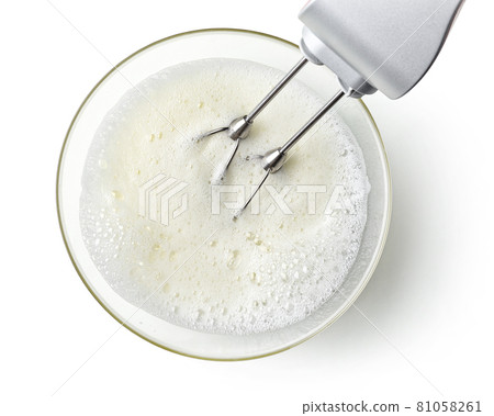 beating egg whites cream with mixer in the bowl beating egg whites cream with mixer in the bowl 81058261