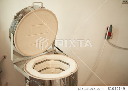 Electric kiln near wall in pottery Electric kiln near wall in pottery 81059149