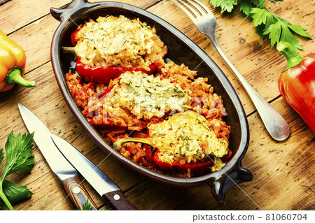 Stuffed peppers with meat on wooden background 81060704