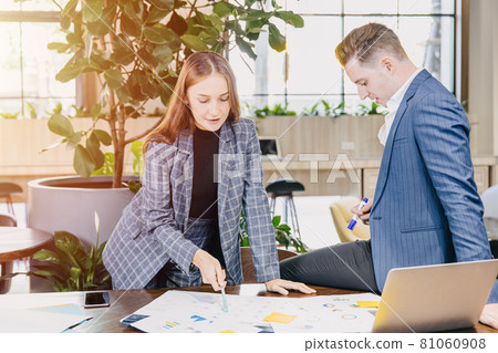 Working women working meet with business man planning jobs together in green modern office. Working women working meet with business man planning jobs together in green modern office. 81060908