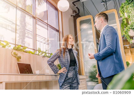 Businesspeople talking together in modern office green plant decoration for business contact or connection meeting. Businesspeople talking together in modern office green plant decoration for business contact or connection meeting. 81060909