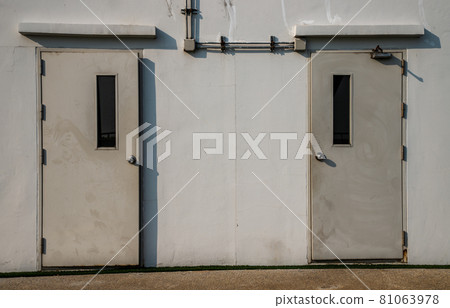 Two white doors of Machine control room. Two white doors of Machine control room. 81063978