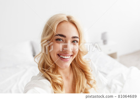 Happy blogger, streaming video, photo for social networks, beautiful model at home 81064689