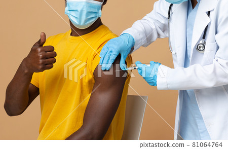 Sucessful Vaccination. Doctor Making Coronavirus Vaccine Injection To Young Black Man Sucessful Vaccination. Doctor Making Coronavirus Vaccine Injection To Young Black Man 81064764