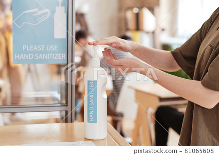 People using hand sanitizer People using hand sanitizer 81065608