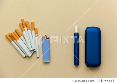 Iqos electronic blue cigarette on a beige background. 81066331