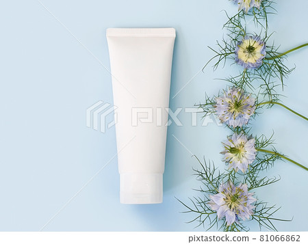 Unbranded white squeeze bottle cosmetic cream tube and line frame border of blue Nigella flowers on pastel blue background. Plastic tube for branding of medicine or cosmetics - shampoo, gel, skin care Unbranded white squeeze bottle cosmetic cream tube and line frame border of blue Nigella flowers on pastel blue background. Plastic tube for branding of medicine or cosmetics - shampoo, gel, skin care 81066862