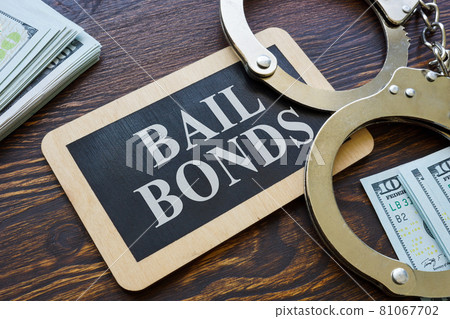 Plate Bail bonds and handcuffs on it. Plate Bail bonds and handcuffs on it. 81067702