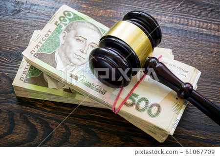 Ukrainian hryvnia money and a gavel. Bribery and corruption in court. Ukrainian hryvnia money and a gavel. Bribery and corruption in court. 81067709
