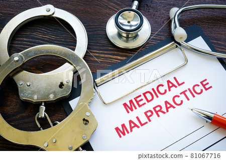 Medical malpractice form with stethoscope and handcuffs. Medical malpractice form with stethoscope and handcuffs. 81067716