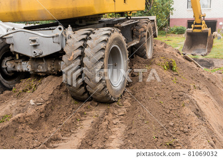 Traces from tire tread on the back of industrial transport excavator or wheel bulldozer Traces from tire tread on the back of industrial transport excavator or wheel bulldozer 81069032