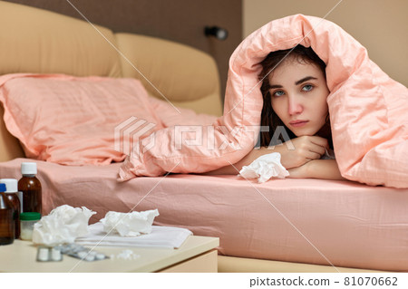 sick girl having influenza symptoms coughing at home 81070662