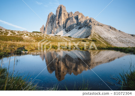 Famous Tre Cime di Lavaredo reflected in small pond, Dolomites Alps Mountains, Italy, Europe. Tre Cime mount in Dolomites 81072304