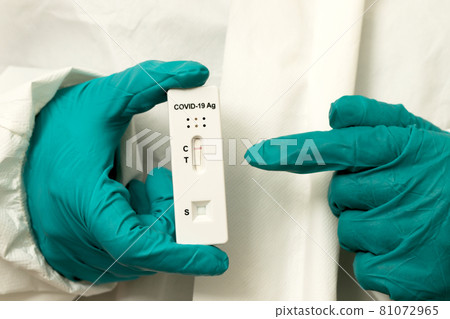 Doctor with Covid-19 test kit from the lab at the hospital Doctor with Covid-19 test kit from the lab at the hospital 81072965