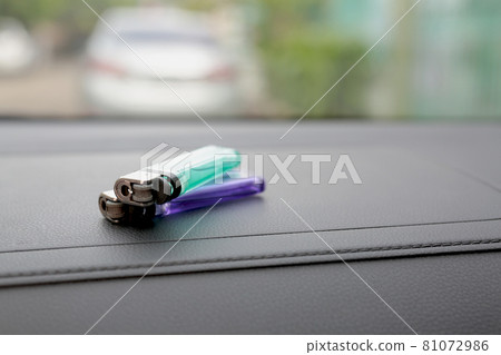 A lighter in front of the car A lighter in front of the car 81072986
