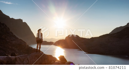 Adventurous Caucasian Adult Woman Hiking on top of a Canadian Rocky Mountain Adventurous Caucasian Adult Woman Hiking on top of a Canadian Rocky Mountain 81074211