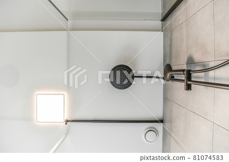Modern shower stall in a bright bathroom Modern shower stall in a bright bathroom 81074583