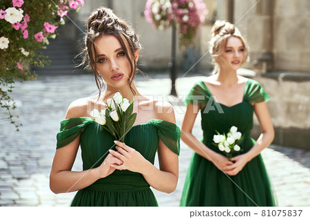 Two beautiful bridesmaids girls blonde and... - Stock Photo [81075837] -  PIXTA