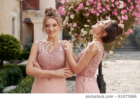 European girls bridesmaids in pink dresses having fun European girls bridesmaids in pink dresses having fun 81075866