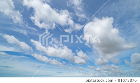 Clear blue sky with white fluffy clouds at noon. Day time. Abstract nature landscape background. 81075870