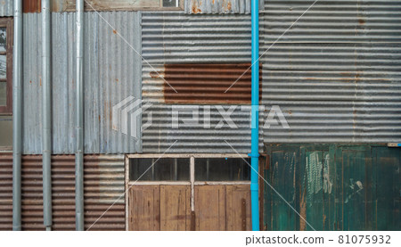 Metal steel strips. Rusty corrugated iron metal, Zinc steel wall, pattern texture background. Close-up of exterior architecture material for design decoration background. Metal steel strips. Rusty corrugated iron metal, Zinc steel wall, pattern texture background. Close-up of exterior architecture material for design decoration background. 81075932