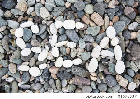 Sea gray stones. Background from sea. Wet gray stones for design.White pebble inscription Sea. 81076537